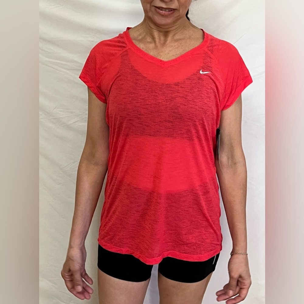 Nike Womens short sleeve workout tee.        Dri fit   Sz Med New